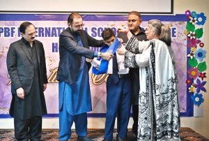 Federal Minister for Overseas Pakistanis and Human Resource Development, Chaudhry Salik Hussain being presented flower bouquet on his arrival at Investiture Ceremony of PBF International School & College H-9.