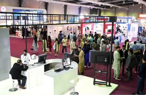 Visitors take interest in a stall during the second day of the Health Asia Exhibition at the Expo Centre
