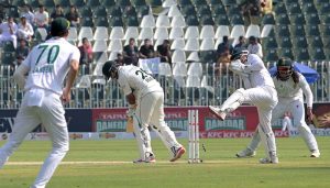 Pakistani batter Abdullah Shafique plays a shot during the first day of the second Test match between Pakistan and South Africa at the Rawalpindi Cricket Stadium.