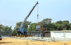 Labourers are busy construction work of T-Chowk Flyover using heavy machinery during development work
