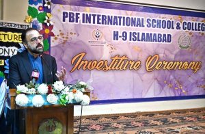 Federal Minister for Overseas Pakistanis and Human Resource Development, Chaudhry Salik Hussain being presented flower bouquet on his arrival at Investiture Ceremony of PBF International School & College H-9.