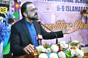 Federal Minister for Overseas Pakistanis and Human Resource Development, Chaudhry Salik Hussain being presented flower bouquet on his arrival at Investiture Ceremony of PBF International School & College H-9.