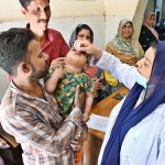 Lady Doctor administering polio drops to a child during anti-polio vaccination campaign at Government Bhitai Hospital