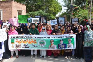 omen University Multan holds a rally in support of the Pakistan Army, led by Vice Chancellor Dr. Kalsoom Paracha, to pay tribute to the soldiers and officers bravely fighting against terrorism and to honor the martyrs.