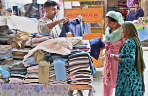 Women are busy purchasing old clothes from vendor at Jilis Bazaar.