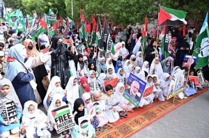 Students of different schools participating in Children Gaza March organized by Jamat-e-Islami Hyderabad outside Press Club Road.