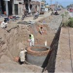 WASA workers are laying new WASA pipeline on Millat Road with heavy machinery