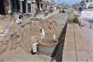 WASA workers are laying new WASA pipeline on Millat Road with heavy machinery