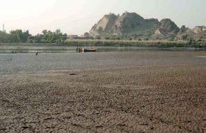 A view of the dry bed of River Chenab in Chiniot after two heavy floods of 855,000 and 550,000 cusecs of water in August and September.