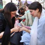 Female participating in mehndi competition during an Event on “Integrated Sports, Theatre, and Arts Activities for Creative Healing and Resilience” organized by The Department of Social Welfare Merged Districts, with the support of UNICEF