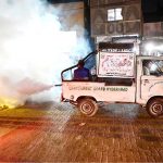 CBH worker busy in spraying anti-dengue fume during malaria & anti- dengue spray campaign at Pathan Colony