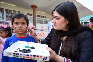Female participating in mehndi competition during an Event on “Integrated Sports, Theatre, and Arts Activities for Creative Healing and Resilience” organized by The Department of Social Welfare Merged Districts, with the support of UNICEF