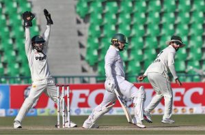 South African batsman Ryan Rickelton plays a shot during the second day of the first Test match between Pakistan and South Africa at the Gaddafi Stadium