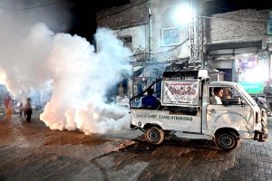 CBH worker busy in spraying anti-dengue fume during malaria & anti- dengue spray campaign at Pathan Colony