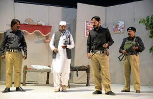 Artists performing in the drama “Anjam” late Saturday night at Z.A. Bhutto Open Air Theater, Arts Council.