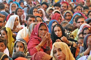 Brides in a group photo during a mass marriage ceremony held under the “Punjab Dhee Rani Program” at Sports Ground.