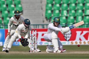 South African batsman Ryan Rickelton plays a shot during the second day of the first Test match between Pakistan and South Africa at the Gaddafi Stadium