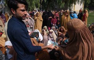 A large number of deserving people wait to receive financial assistance under the Benazir Income Support Programme (BISP) at Government Shaheed Mubeen Shah Afridi Higher Secondary School No. 01 in the provincial capital