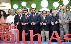 Federal Minister for Health Syed Mustafa Kamal along with others cutting the ribbon to inaugurate the Health Asia Exhibition at Expo Center.