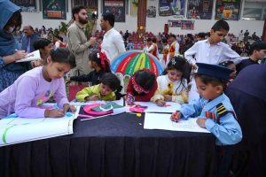 Female participating in mehndi competition during an Event on “Integrated Sports, Theatre, and Arts Activities for Creative Healing and Resilience” organized by The Department of Social Welfare Merged Districts, with the support of UNICEF