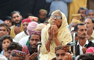 Brides in a group photo during a mass marriage ceremony held under the “Punjab Dhee Rani Program” at Sports Ground.