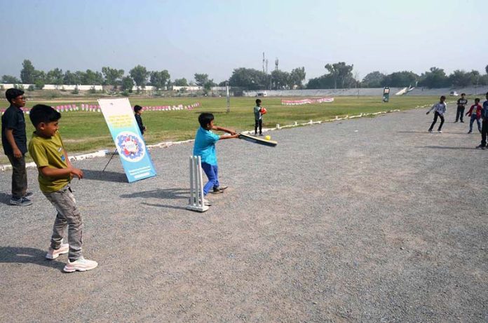 Youngsters playing cricket during an Event on “Integrated Sports, Theatre, and Arts Activities for Creative Healing and Resilience” organized by The Department of Social Welfare Merged Districts, with the support of UNICEF