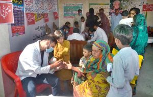 Doctor examine the patients during 8th Free Medical Camp in Moza Qazian for flood affected people arranged by Islamia Hospital.