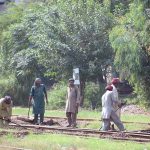 Railways workers busy in work to clear the railway tracks near Railway Station.