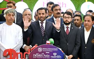 Federal Minister for Health Syed Mustafa Kamal along with others cutting the ribbon to inaugurate the Health Asia Exhibition at Expo Center.