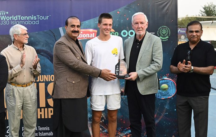 Senator Salim Saifullah Khan, Vice President of the Asian Tennis Federation, presenting prizes to the players during the prize distribution ceremony after the Boys Singles Final of the ITF Pakistan International J-30 Junior Tennis Championships 2025 (Leg-1) at the PTF-SDA Tennis Complex