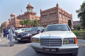Visitors take interest in vintage cars displayed during the Vintage Classic Car Show at the museum.
