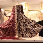 Vendors displaying bridal dresses for sell at thier shop to attract the customers at Cantt Bazar