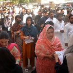 Candidates entering the venue of first preliminary objective test for the posts of the Civil Judge and Judicial Magistrate at the Sindh High Court (SHC) Lawn.