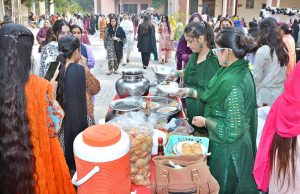 Students take interest in handmade embroidered items displayed at different stalls during the two-day Sports Gala at Women University, Katchery Campus.