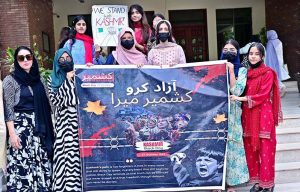 Students of Government College Women University Faisalabad (GCWUF) participate in a walk organized to mark Kashmir Black Day at the university campus.