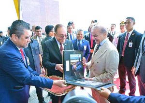 Prime Minister of Malaysia Dato Seri Anwar Ibrahim presents photographic album to Prime Minister Muhammad Shehbaz Sharif documenting his three days visit.