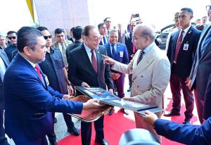 Prime Minister of Malaysia Dato Seri Anwar Ibrahim presents photographic album to Prime Minister Muhammad Shehbaz Sharif documenting his three days visit.