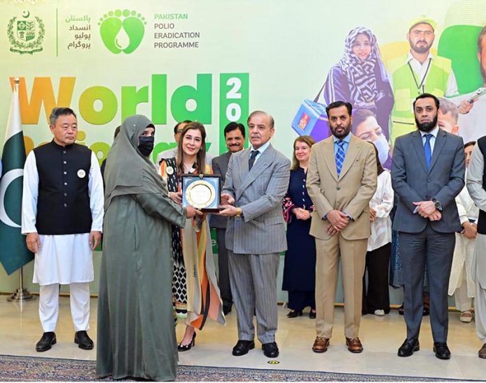 Prime Minister Muhammad Shehbaz Sharif presents awards to polio workers for the recognition of their services in the Pakistan Polio Eradication Programme, on World Polio Day
