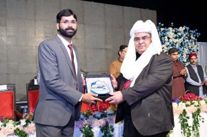 Mr. Justice Muhammad Saleem Jessar Justice of Sindh High Court (Circuit Court Larkana) giving away shield to Police Officer Junaid Ahmed Jaisar during launching ceremony of his book titled "Criminology" at Sir Shahnawaz Bhutto Library Park.