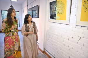Women viewing the exhibition “Tree for Life”, a solo show by Farrah Mahmood, at FMR Art & Culture Gallery