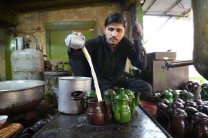 A worker prepares the famous Qehwa and tea at a shop in Qissa Khwani Bazaar, one of the oldest markets in South Asia, where traditional food shops, hotels, and Qehwa Khanas attract a large number of visitors
