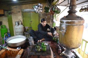 A worker prepares the famous Qehwa and tea at a shop in Qissa Khwani Bazaar, one of the oldest markets in South Asia, where traditional food shops, hotels, and Qehwa Khanas attract a large number of visitors