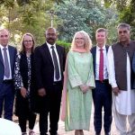 Senator Khalil Tahir Sandhu in a group photo with foreign dignitaries during a relief goods distribution ceremony in Sialkot.