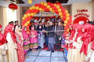 Provincial Secretary for Culture and Tourism, Dr. Abdul Samad and China Window Administrator Amjad Aziz Malik along with other officials and students cutting ribbon during the inauguration ceremony of Mid-Autumn Festival celebration organized by China Window.