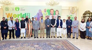 Prime Minister Muhammad Shehbaz Sharif in a group photo with the team of the Pakistan Polio Eradication Programme on the World Polio Day