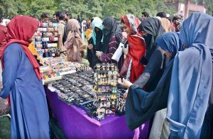 A student making clay pot on stall during Zarai Mela at University of Agriculture Faisalabad (UAF)