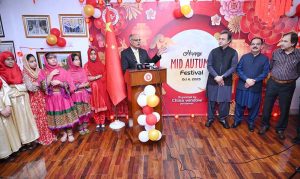 Provincial Secretary for Culture and Tourism, Dr. Abdul Samad and China Window Administrator Amjad Aziz Malik along with other officials and students cutting ribbon during the inauguration ceremony of Mid-Autumn Festival celebration organized by China Window.