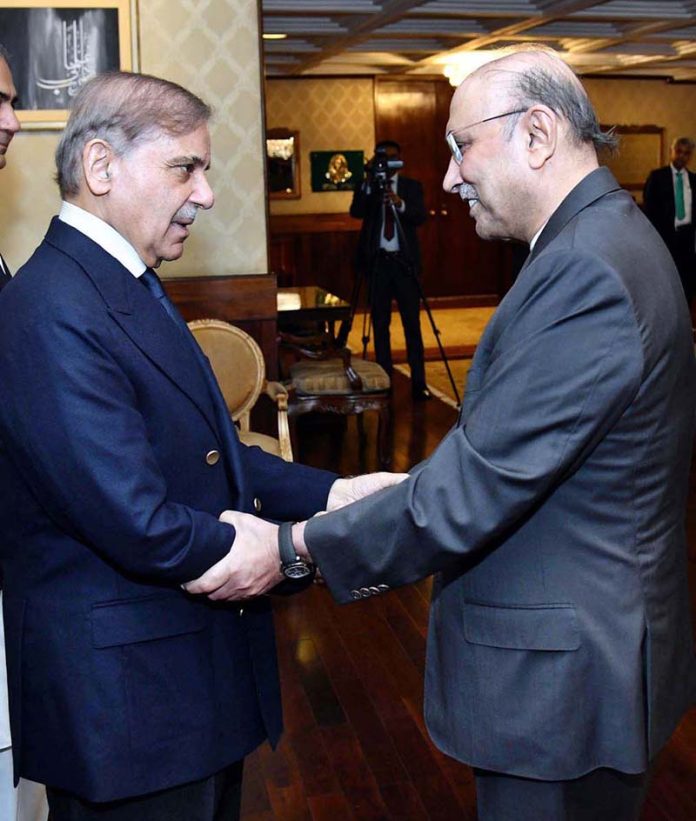 President Asif Ali Zardari shaking hands with Prime Minister Muhammad Shehbaz Sharif at Aiwan-e-Sadr