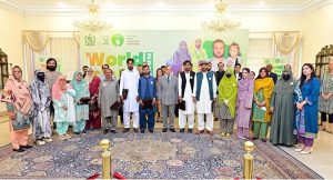 Prime Minister Muhammad Shehbaz Sharif in a group photo with polio workers of the Pakistan Polio Eradication Programme who were given awards at the World Polio Day Ceremony