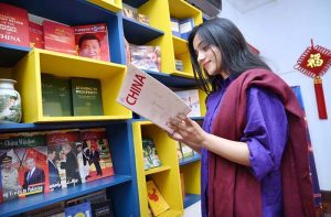 A visitor taking interest in on display books of china during the Mid-Autumn Festival celebration organized by China Window.